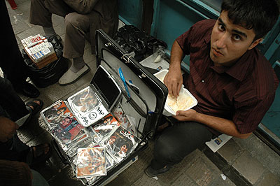 Behrouz Arshidi, 24, street-side seller of pirated films in the Great Bazaar of Tehran 