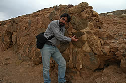 Art historian Abdulreza Soleimani examining 2500-year-old Achaemenidian stone crypt