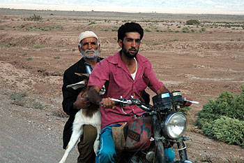 Two men and a goat, Dasht-e Kavir desert, near Sabzevar, NE Iran